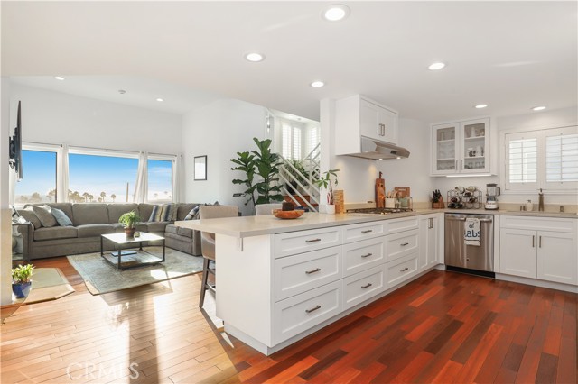 Showcasing the Brazilian Cherry wood floors and remodeled kitchen.