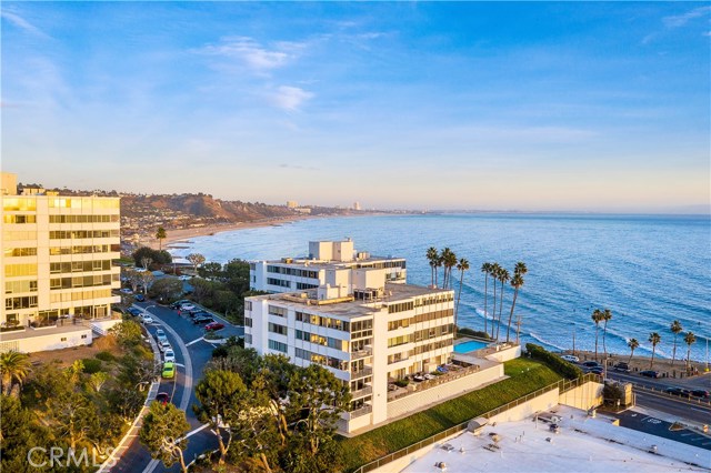 17368 W Sunset Boulevard 202 Pacific Palisades, California Welcome to this stunningly upgraded Pacific Palisades Oceanfront corner unit. Step in and be greeted by the luxurious carrara marble entryway, leading to the jaw-dropping unobstructed 120 degree Pacific Ocean views. Enjoy full panoramic ocean views from almost every room, including the living room, dining, kitchen, and even from the master bedroom. The dual master bedrooms each have their own private en suite bath. The second bedroom offers spectacular Tuscany like hillside views. Some of the recent upgrades include new carpet and fresh paint throughout. The remodeled cooking area & breakfast bar have been topped with Caesarstone marble and offer lazy-susan style cabinets with soft-close drawers and pull-out pantry shelves. Appliances include a Bosch dishwasher, Frigidaire Gallery refrigerator, 5-burner gas stove, and much much more, a must-see in person to appreciate. Relax and take in the breathtaking sunsets from your incredibly large and private flagstone-inlay patio. With no one to your left or your right, the privacy and serenity this unit offers is unmatched. Located in the prestigious “A” building of the Edgewater Towers, this home includes unbeatable amenities such as two in-ground saltwater pools and spas, a full gym, ocean-view gazebo, club room, tennis court, half-court basketball hoop, electric car chargers, and 9 acres of immaculately maintained walking trails. Don’t miss the opportunity to own one of the best oceanfront condominiums in all of Pacific Palisades.