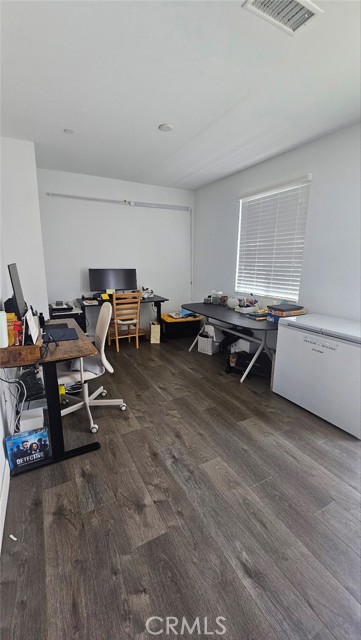 The first-floor den can be used as a third bedroom or home office