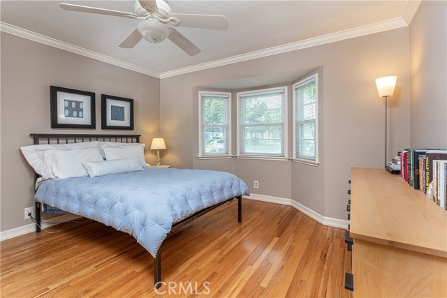 The front bedroom has plenty of closet space and beautiful crown molding!