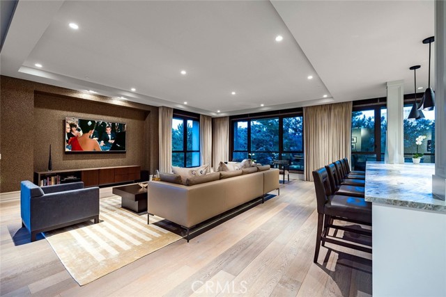 1427 Santa Barbara Drive Newport Beach, California Set within a private enclave community, this masterfully designed Meridian one-story residence reflects privacy and sophistication. Enjoy a high caliber of living in a world-class location moments from some of the finest leisure destinations in the city. Once inside the gallery-inspired foyer, an open-concept floor plan awaits, with unparalleled design and exquisite designer finishes around every corner of this home. Walls of retractable glass vanish and provide an influx of natural light, seamlessly blurring the lines between indoors and outdoors to offer the ultimate Southern California lifestyle. Featuring modern lines and refinement, there are two bedrooms, two-plus baths, a generously proportioned great room and a den/flex space. The opulent Primary suite is a true retreat featuring custom silk draperies, California Closets custom closet and an en-suite bath highlighting Porta Romana sconces, Water Mark Designs fixtures, spa-like soaking bathtub, Excelsior custom European-style cabinets, Metropolis Gray Quartz slab stone surfaces, full wall tile at tub/shower in Oyster White Brushed finish and custom designer lighting. The lavish secondary bedroom offers custom linen draperies, custom closet system and en-suite bath showcasing Metropolis Gray counter top and Ponza deco tile wall enhancing ultimate luxury and privacy. The spectacular chef-worthy kitchen features forward thinking design highlighting Leathered Satin marble counter top and grand center island, full backsplash weave glass incandescent, Wolf, Sub-Zero and Bosch appliances inclusive of Sub-Zero wine storage, refrigerator and drawers, Wolf Dual Fuel range, warming drawer, wide plank wood floors by Gaetano, Fleetwood sliding glass walls to the outdoor terrace where incredible tranquil views can be admired. Additional features of this fully equipped home include Lutron lighting system, motorized light-filtering roller shades, Chiavasso and Jab Anstoetz custom window treatments, luxe wall finishes, designer lighting, Kallista fixtures, high efficiency features, California Closet accoutrements all throughout, home technology, entertainment, automation and security system prewire throughout, semi-private elevator service directly to your front door, private storage space and The Meridian resort-like amenities inclusive of pool, spa, outdoor cooking areas and Concierge. Enjoy a lifestyle of convenience and comfort within this trophy of sleek design.