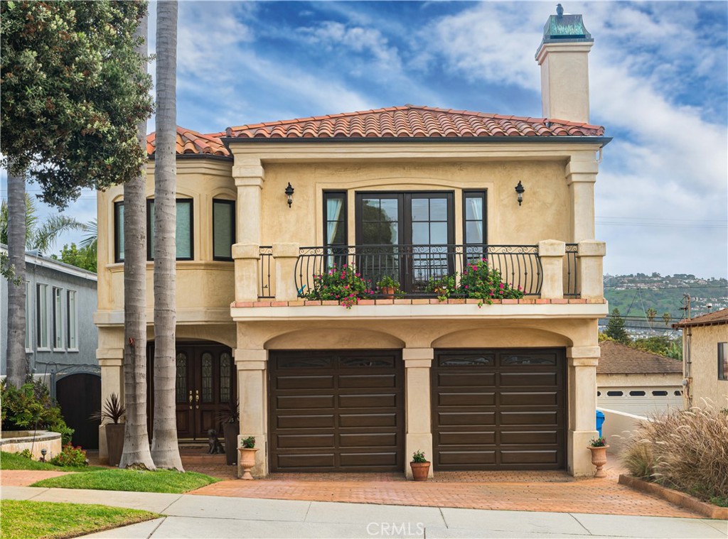 This custom home is located on the desirable Avenues, just blocks from the beach and Riviera Village, offering the perfect blend of relaxation and entertainment. The home is generously sized, featuring upper and lower level living areas with a total of 3 cozy fireplaces to keep you warm on chilly evenings. The media room is custom designed for your viewing pleasure, while the gourmet kitchen is equipped with custom granite counters, a Wolf 6 burner range, Wolf microwave, Wolf under counter warming drawers, a SubZero refrigerator, 2 dishwashers, a wine cooler, and even an in-cabinet Miele coffee espresso machine for your morning brew. From the living areas, you can enjoy Palos Verdes and ocean coastline views, while the spacious rooftop deck offers 180 degree views, providing the perfect setting for entertaining guests or simply relaxing with a book. Throughout the house, you'll find custom cabinetry, granite, onyx, Carrera marble counters, travertine marble floors, and custom oversize plank walnut hardwood floors, adding to the luxurious feel of the home. The primary suite features its own private fireplace, a spacious spa steam shower, a Bain Ultra air tub, and a large walk-through custom closet. There is also a second en-suite bedroom for added convenience. A spacious laundry room makes household chores a breeze, while the massive backyard offers ample space for outdoor activities and gatherings. With all of these features and more, this custom home is truly a one-of-a-kind gem.