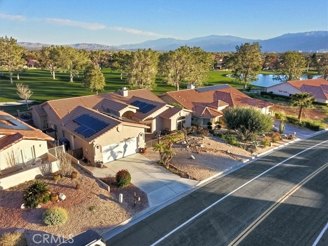 Street View Featuring Neighbors and Golf Course Lake.