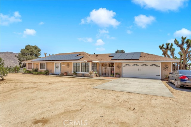 Gorgeous remodeled home with solar and fenced in acres, well and mountain views.