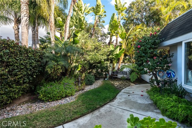 The front courtyard is secluded and lush