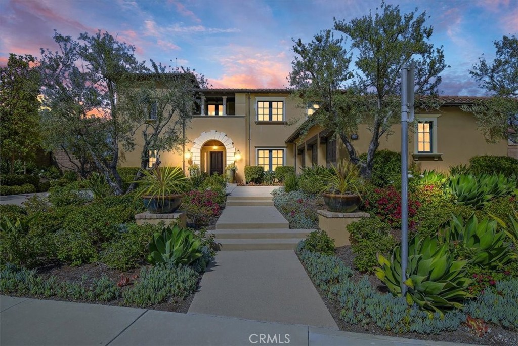 Stunning & sophisticated 4,815 sq. ft. home plus 453 sq. ft. Casita on nearly a 1/2-acre private, lot. Behind the gates of the exclusive Olivia limited development community w/only 40 estate-style, semi-custom homes.  Popular plan 3, built in 2016 features a unique main floor master suite and downstairs den off the entry.  The second floor provides 3 bedrooms, each with their own en-suite bath, and a bonus room with gorgeous views of the hills.  Masterfully designed & highly upgraded w/great attention to detail.  This grand residence features an open floor plan with twelve-foot ceilings throughout.  Great room with floor to ceiling fireplace features a full bi-fold door wall & adjacent opening wall off the dining room which opens to an expansive covered loggia & backyard creating the perfect indoor/outdoor luxury living experience.  Large gourmet kitchen is a chef's dream complete w/stainless steel Wolf 6 burner 48” gas range stove, wall hood. microwave, Bosch dishwasher, Sub Zero refrigerator, European cabinetry w/self-closing doors, quartz counters, center island w/counter seating & two large walk-in pantries. Master bedroom boasts french doors for private backyard access & a spa-like bath w two separate vanities, luxurious soaking tub, separate shower & massive walk-in closet with custom closet organizer. The Casitas w/ensuite bath features two full bi-fold door walls which open to a second expansive covered loggia & backyard which features multiple sitting areas.
Enjoy the high-end finishes throughout.  Wood flooring, plush carpet, 7” baseboards, custom paint, upgraded tile in all baths, designer window coverings & lighting throughout the entire home. For ultimate convenience there is a laundry room on the main level and an oversized laundry room upstairs with lots of cabinets, counters & utility sink.  For ultimate storage there is a mud room with an abundance of cabinets & utility sink which leads to the finished 3 car garage w/epoxy floors. Proximity to public schools & top-rated private schools such as St. Margaret's J Serra & Capistrano Christian. Approx. 2 miles to Doheny Beach & Dana Point Harbor, approx. 1 mile to San Juan shops. 1.5 miles to the SJ Train Depot. Just minutes to beaches, freeways, golf, local dining, shopping & more. Low Tax Rate, No Mello Roos.