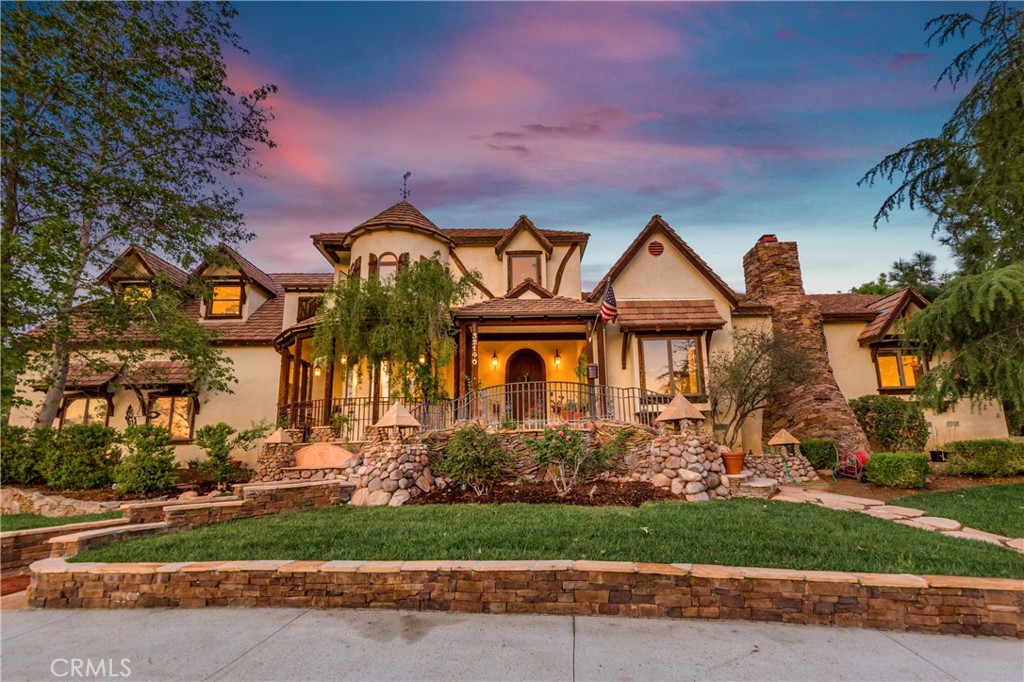 Welcome home to this GORGEOUS custom estate with just over 10 acres of land on one of the most private streets in all of Agua Dulce! As you drive up to this property, you are greeted with a stunning gate that leads you into your own private oasis! This impressive home has just about everything you are looking for, and plenty of room to build it if it doesn't! The primary bedroom is located downstairs with a cozy fireplace and has a wonderful ensuite bathroom that has a jetted tub and large closet. Off the primary bedroom, there is access to its own private side yard where you can relax in the evening or install a spa that you could soak in after a long day at work! There are three other bedrooms located upstairs, along with several other rooms that could be used as bedrooms, nurseries, offices or playrooms. There are beautiful hardwood floors throughout, vaulted and beamed ceilings, a separate living and family room, a formal dining room, a huge great room and an enticing front patio. The chefs kitchen features designer Viking & Miele appliances, custom cabinets, newer countertops, a center island with an additional sink. The home has an attached 2-car garage with vaulted ceilings, plus a long circular driveway with room for all your vehicles and parking for your recreational vehicles. The grounds are spectacular with luscious grass, shrubs and trees, serene ponds and waterfalls & a built-in BBQ area that has a covered patio area. There is a small, detached outbuilding with a full bedroom and bathroom that is perfect for a guest house, an ADU or a workshop. Excellent output from the well tied to irrigation with 20 stations. There are 3 HVAC units, copper piping throughout and dual paned windows. Lastly, enjoy the privacy surrounding your home, miles of adjacent trails and views galore! HURRY! Wont last!!!