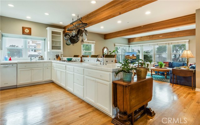 Sparkling kitchen with breakfast counter.