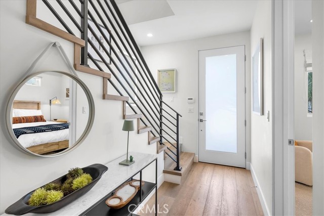 Front door and stairs down to lower level