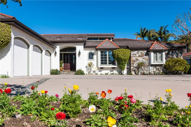 Nicely landscaped with beautiful flower beds in front and rear yard.