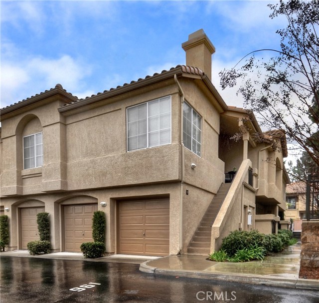 End unit, stairs lead up to home. Attached 1 car garage. Assigned parking#193  right in front of home.