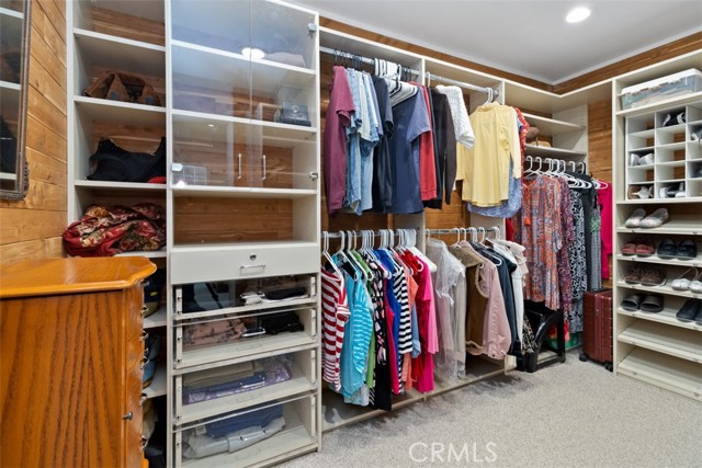 Organized Primary Suite Walk In Closet