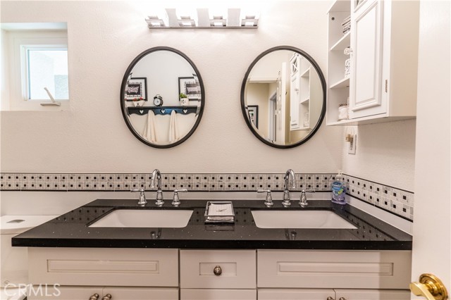 Dual sink vanity in third bathroom