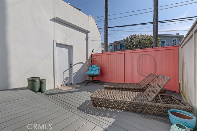 Incredible sunning deck adjacent to the lowest bedroom also leads to the rear yard.