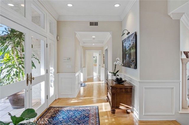 Entry & Hall Leading To Master Suite, Guest Bedroom and Powder Bath