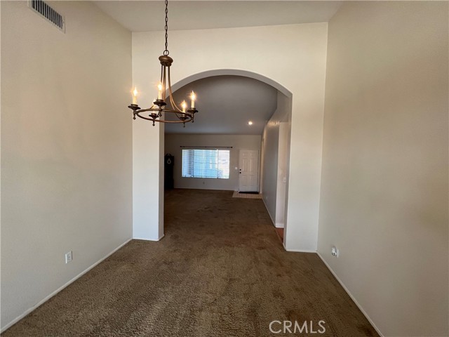 vaulted living room ceiling to formal dining room