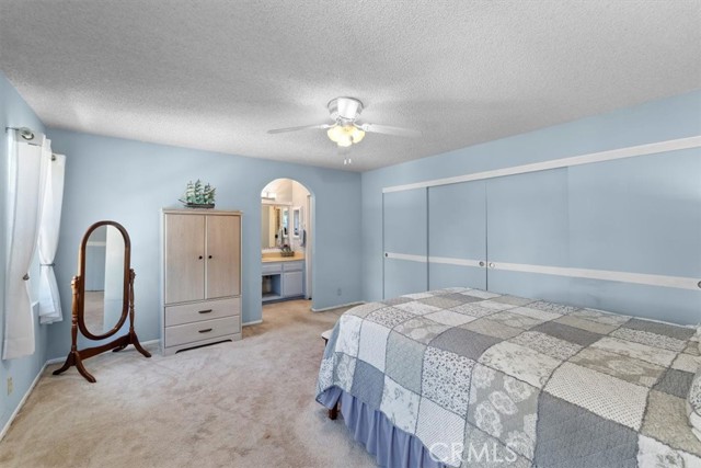 You can see the bathroom through the doorway. it is a 3/4 bath (shower stall) and has a vanity and a walk-in closet.