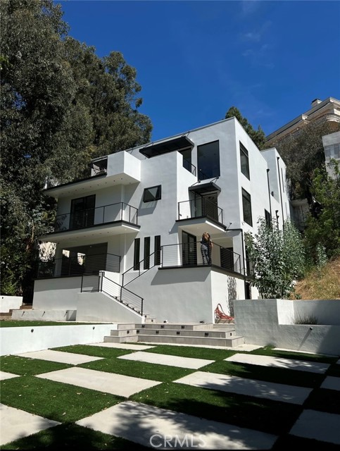 Unique property with two addresses and separate entrances; front door is found on 1406 Sunset Plaza. Newly remodeled entertainer's dream home moments away from the Sunset Strip. This 3-story residence features 5-bd, 5-bth, and parking for 8+ vehicles. Its bright & open floor plan is thoughtfully designed to showcase California's indoor-outdoor lifestyle. High ceilings, tasteful French Oak floors, and integrated security system found throughout. The main level includes a powder room, screening room & living room. The gourmet Chef's kitchen boasts incredible city views, Wolf & Viking appliances and Fleetwood glass sliding doors that open onto the terrace. On the second level, the master suite has a large custom wardrobe and spacious master bath with separate tub and double sinks. Two additional en-suite bedrooms are separated by an inviting den and attached laundry room. Lower level has a wine cellar, wet bar and an en-suite bedroom. Generously sized rear yard with room for a pool.