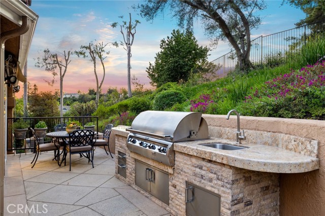 Built-in barbecue with another seating area.