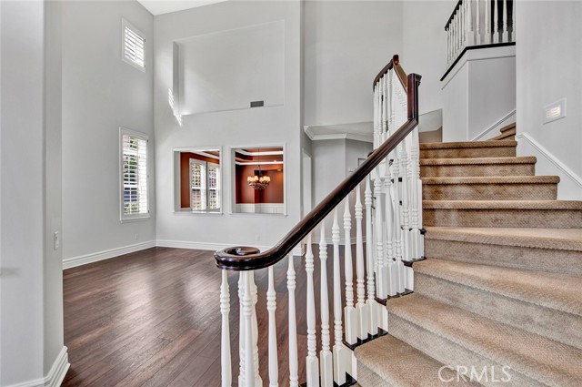 Double staircase and views to the living room.