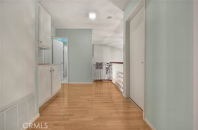 View Of Upper Floor Hallway. Right Door Leads To Laundry Room For Washer & Dryer.