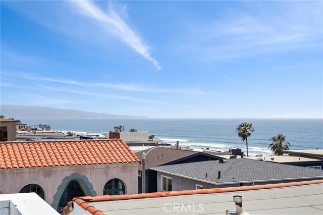Family room views of sand and white water, MB Pier and Palos Verdes to Malibu Peninsula