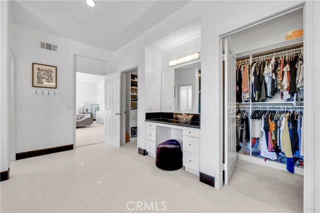 Connected His & Hers Walk-In Closet