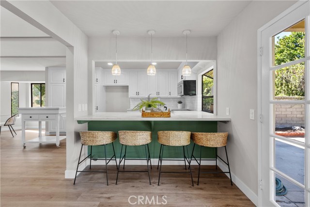 Kitchen with seating at the counter.