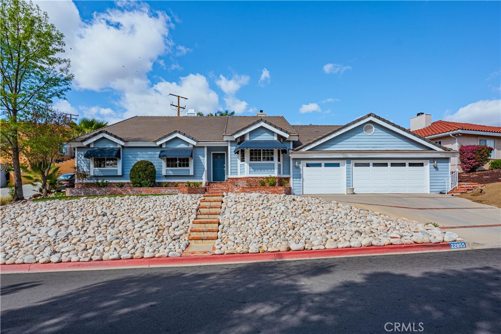 This beautifully updated 3 BEDROOM PLUS DEN/OFFICE  home features tile and upgraded custom cabinetry throughout the home. A formal living room greets you with vaulted ceilings and a nearby powder room.  The ample modern kitchen features upgraded cabinets, light filled bay window, and quartz countertops. The central dining room sits between the kitchen and living areas for easy entertaining. Adjacent to the kitchen is a cozy family room with modern fireplace. The primary suite is spacious and features a large closet with built-ins and a luxurious bath with soaking tub, walk-in shower and plenty of cabinet room. The two extra bedrooms are perfect size and conveniently located nearby is the secondary bath upgraded with stone and tile. There is also a den that could be converted to a 4th bedroom. A total of 2 1/2 baths, a walk-in laundry room and spacious 3 CAR GARAGE make this the perfect home. This home's interior has some steps within. Canyon Lake is a GATED COMMUNITY with a recreational lake for boating, skiing and fishing, an 18 hole golf course, country club, waterfront lodge, tennis, pickleball, basketball, baseball fields, equestrian center, senior center, 2 restaurants and numerous waterfront parks throughout the community. Don't miss out!