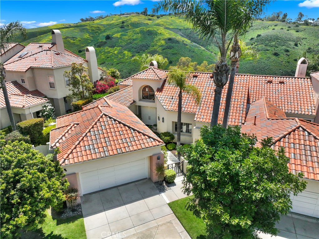 Welcome to your private sanctuary in the exclusive gated community of Siena at Marina Hills in Laguna Niguel. This masterfully reimagined single-story home blends coastal luxury with refined modern living, all set against a backdrop of panoramic hillside views.

Extensively newly renovated with over $225,000 in thoughtful upgrades, No detail was overlooked—from the fully remodeled kitchen with custom cabinetry and quartzite countertops and backsplash to the completely remodeled bathrooms, engineered oak wood flooring, new lighting, and refreshed landscaping—every element was chosen to elevate comfort and style.

This home is defined by its impressive architectural design—featuring dramatic vaulted and sloped ceilings, soaring nine-foot raised ceilings, and custom-crafted eight-foot entry doors. Oversized windows in the primary suite, living, and dining areas flood the interior with natural light, enhancing the home’s sense of volume and openness. The combination of elevated ceilings and an airy, open layout creates a feeling of spaciousness that far exceeds expectations.

Bask in the ocean breezes and natural light that pour through expansive windows and French doors, or step outside to enjoy the surrounding walking, hiking, and biking trails just moments from your doorstep.

Homeowners in Siena enjoy exclusive access to private community amenities including a pool, spa, and cabana. Residents also benefit from Marina Hills’ resort-style offerings: a competition-size pool and spa, tennis courts, clubhouse with kitchen and fireplace, soccer fields, basketball and sand volleyball courts, plus picnic and BBQ areas.

Ideally located just minutes from the coastline, award-winning schools, and fine dining, this is coastal living at its finest—where every detail has been considered, and every upgrade already done.