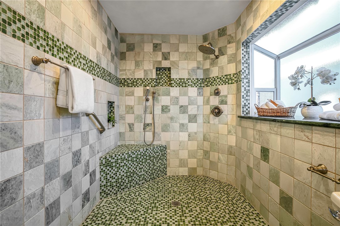 Primary shower has bay window and upscale design
