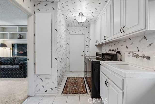 The laundry room with direct access to the garage.