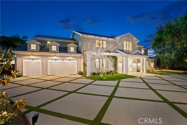 4509 Noeline Avenue Encino (los Angeles), California Nestled on a sprawling 31,685 sq ft lot in a prestigious south-of-the-boulevard Encino neighborhood, this grand estate masterfully combines traditional charm with contemporary luxury. A striking two-story entry welcomes you into an expansive dining room, leading to a sun-drenched kitchen and family room, all seamlessly flowing to a covered patio, pool, extensive lawns, sports court, and outdoor decks—ideal for both relaxation and entertaining. The main floor boasts a luxurious tiered screening room, a stately paneled library/executive office, a spacious guest bedroom, billiards room, butler’s pantry, powder room, and one of two convenient laundry rooms. Upstairs, the opulent primary suite features a private living room with a fireplace, a bedroom with cathedral-beamed ceilings, a generous terrace overlooking the grounds, a spa-like marble bath, and dual walk-in closets. Three additional grand en-suite bedrooms and an airy family room complete the upper level. A detached guest house offers a cozy living room, kitchenette, lavish bathroom, and a private bedroom—perfect for guests or staff. The expansive rear grounds are an entertainer's dream, with a BBQ and bar area, vast lawns, and a versatile sports court ideal for pickleball, basketball, roller skating, or large gathering