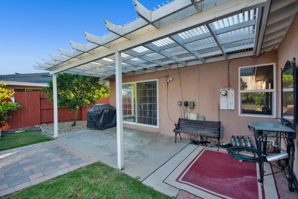 Backyard showing Patio, a sink and a BBQ grill