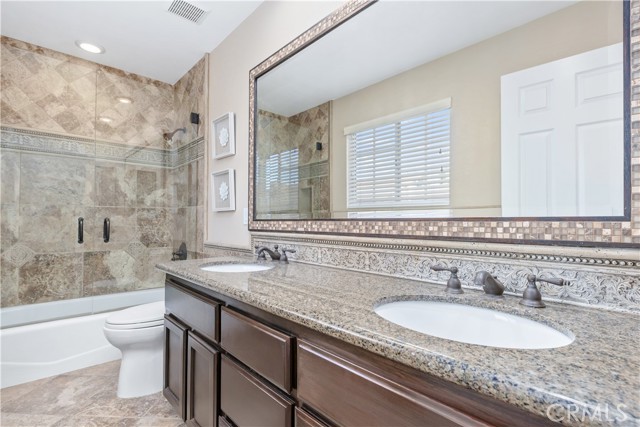 Full sized remodeled bathroom with dual vanity in the upstairs hallway