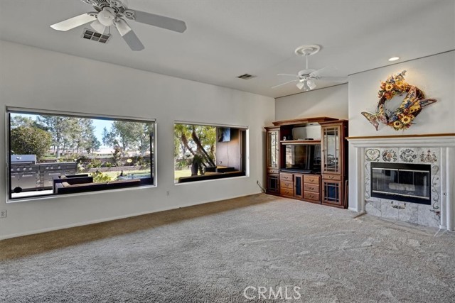 Family Room Featuring Outdoor Cook Island, Fireplace and Double Fairway Views.