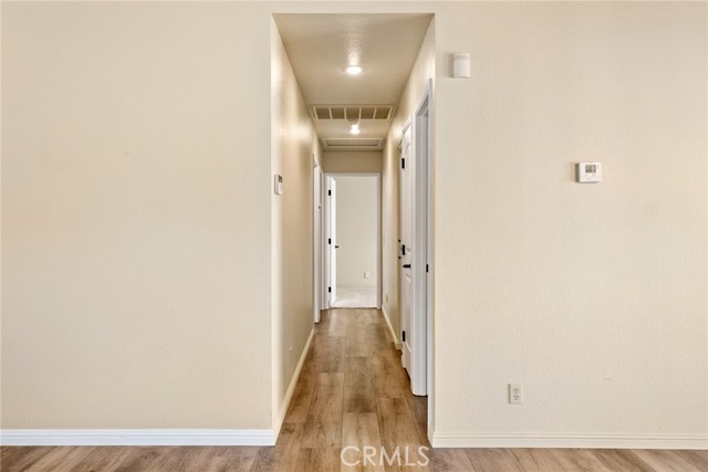 Time to see the bedrooms and bathrooms. There is a built in linen cabinet and a closet in the hallway.