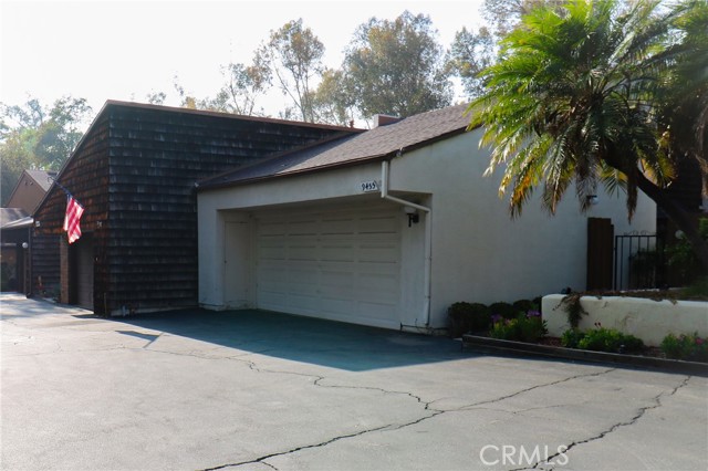 Front entrance to unit. 2-car garage includes storage and workbench.