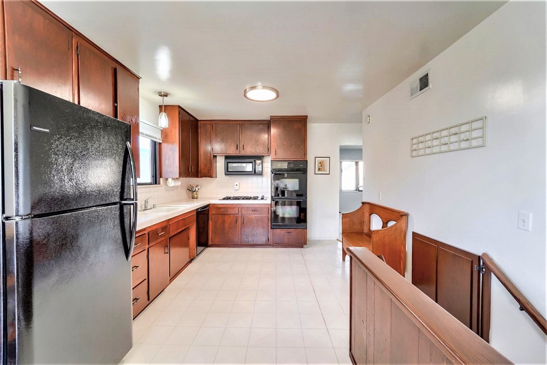 The stairway to the right leads to the lower level of the house where there is a 4th bedroom, a full bath and a huge bonus room.