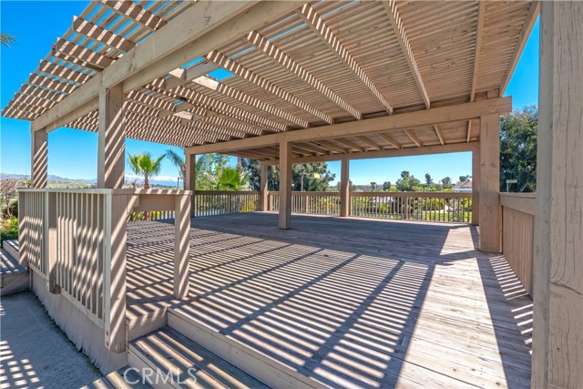 Covered deck overlooking tennis court