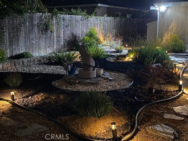 Low maintenance backyard with Lights
