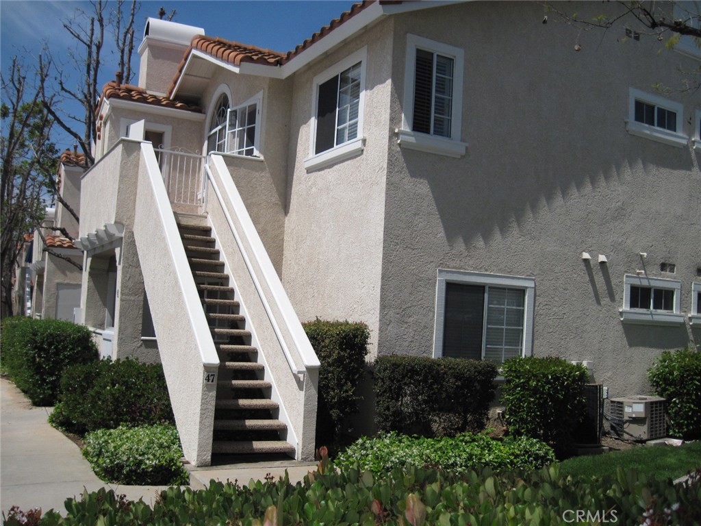 THIS PRIVATE, UPPER END UNIT IS NEAR PARKS, SCHOOLS, LAKE RSM AND SHOPPING! ENJOY UPGRADED FIXTURES, A ROMANTIC FIREPLACE, AND CUSTOM WINDOW COVERINGS. THE TWO BEDROOMS ARE SEPARATED BY THE LIVING AREA, EACH WITH ITS OWN BATH. INCLUDED ARE A REFRIGERATOR, WASHER AND DRYER, MAKING THIS SUNNY CONDO MOVE-IN READY. THE BALCONY IS PERFECT FOR A BBQ. THE COVERED CARPORT IS CONVENIENTLY LOCATED AT THE BOTTOM OF THE STAIRS! WITH LOTS OF GUEST PARKING AND A GREAT POOL AND SPA AREA,THIS CONDO OFFERS THE BEST OF ORANGE COUNTY LIVING.