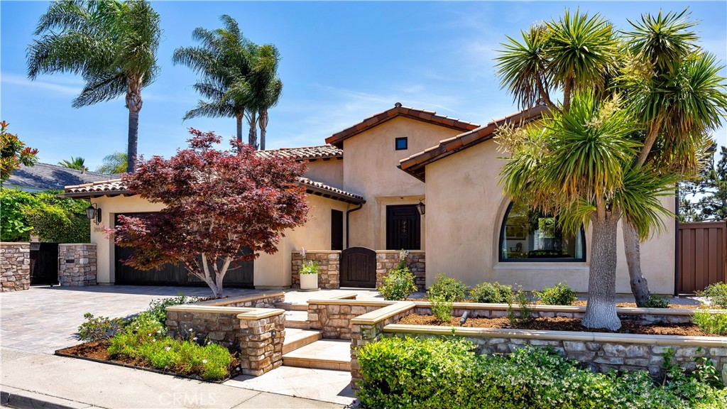 Location, Luxury & Lifestyle – Welcome to 24192 Las Naranjas Drive! Perched atop the hillside in the highly desirable Pacesetter II neighborhood of Laguna Niguel, this beautifully remodeled single-story Spanish-style home offers the perfect blend of charm, space, and beautiful views. Enjoy tranquil vistas of rolling hills and even a peek of the ocean on crystal-clear days—this is Southern California living at its finest. Step through a welcoming front courtyard into a home that exudes character and warmth. Inside, you’ll find gleaming hardwood floors, an open-concept layout, and abundant natural light that pours through every corner. The gourmet kitchen is a chef’s dream, boasting stone countertops, stainless steel appliances, custom cabinetry, and an oversized wine refrigerator. The spacious family room is the heart of the home, seamlessly connecting to the outdoors with a fully collapsible panoramic wall of windows that opens to a covered back patio—ideal for entertaining or relaxing while soaking in the views. The generously sized dining room offers versatile use—transform it into a game room, movie room, or keep it as the perfect space for large gatherings. With two bedrooms plus an office (easily convertible into a third bedroom), the layout is both flexible and functional. The primary suite features beautiful views, a walk-in closet, and a luxurious en suite bath complete with stone countertops, a walk-in shower, and a private dry sauna for ultimate relaxation. All three bathrooms have been tastefully updated with quality finishes. Outside, the beautifully landscaped backyard offers a built-in BBQ, retractable sunshades, and ample space to unwind or entertain under the California sun. Located just minutes from the the coast, Marina Hills Shopping Center, Laguna Niguel Town Center, Dana Point Harbor, hiking and biking trails, top-rated schools, the YMCA, and freeway access—this is not just a home, it’s a lifestyle. Come experience the beauty, comfort, and convenience of 24192 Las Naranjas Drive. Your dream home awaits!