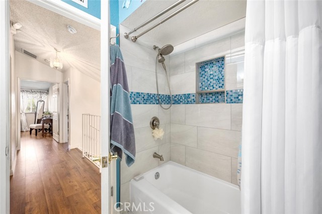 Full bath with tub/shower combo.