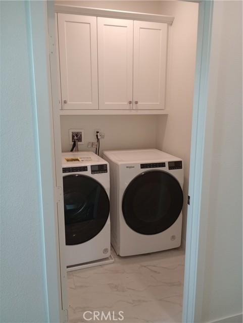 laundry room with washer and dryer
