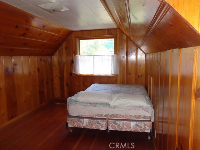 Bedroom top left of stairs