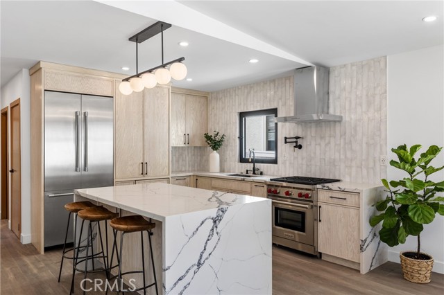 Gourmet Kitchen with quartz waterfall island