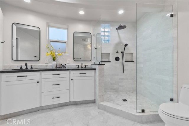The spa-like bath is a relaxing retreat with gorgeously styled features.