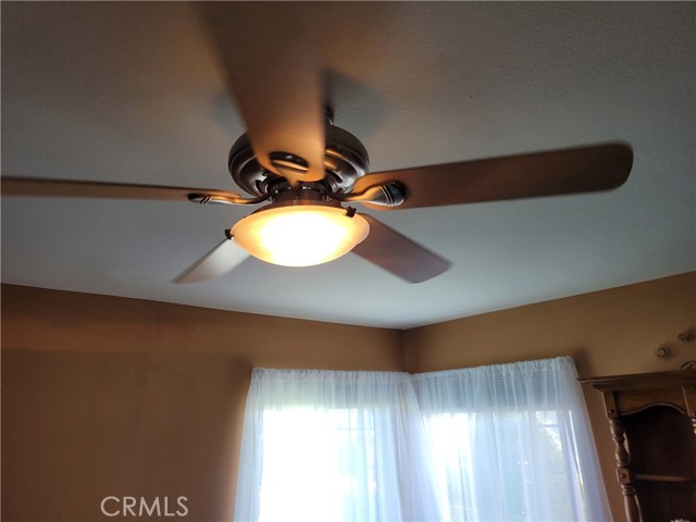 Ceiling fan at primary bedroom.
