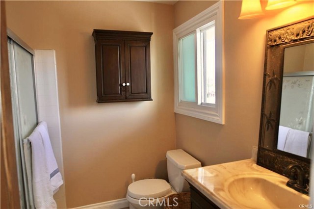 Classic wood cabinets and stylish mirrors.